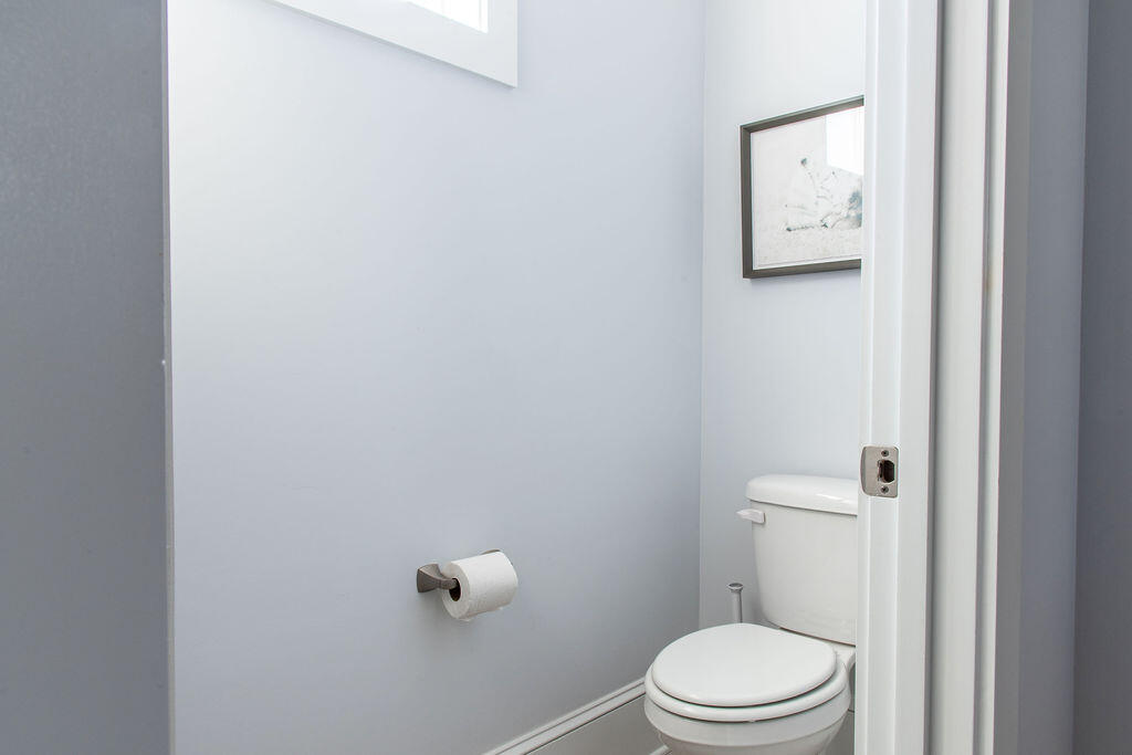 76 West Crabbing Hole Ln Inlet Beach Inlet Beach, FL 32461 - Photo 17 of 86 a white toilet sitting next to a shower