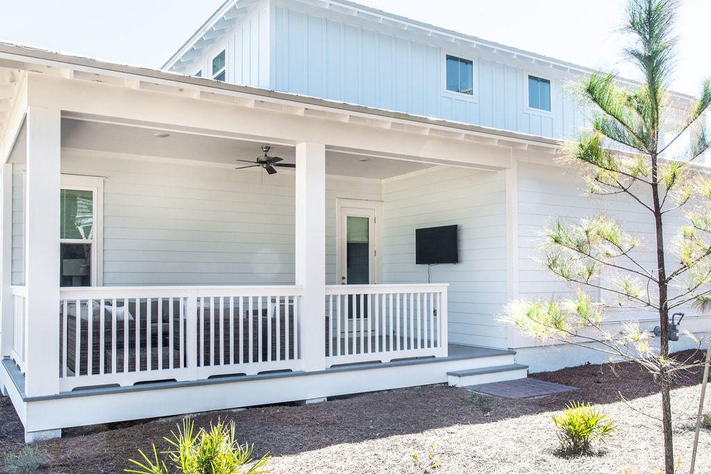 76 West Crabbing Hole Ln Inlet Beach Inlet Beach, FL 32461 - Photo 23 of 86 a view of a porch with a table and chairs