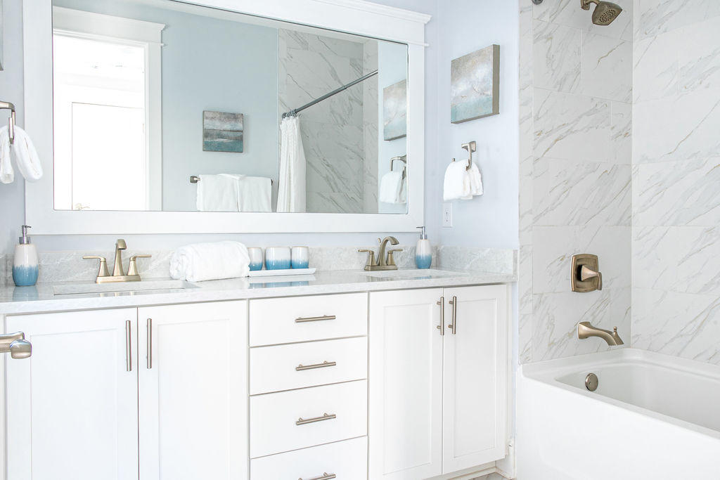 76 West Crabbing Hole Ln Inlet Beach Inlet Beach, FL 32461 - Photo 38 of 86 a bathroom with vanity granite tub sink and mirror