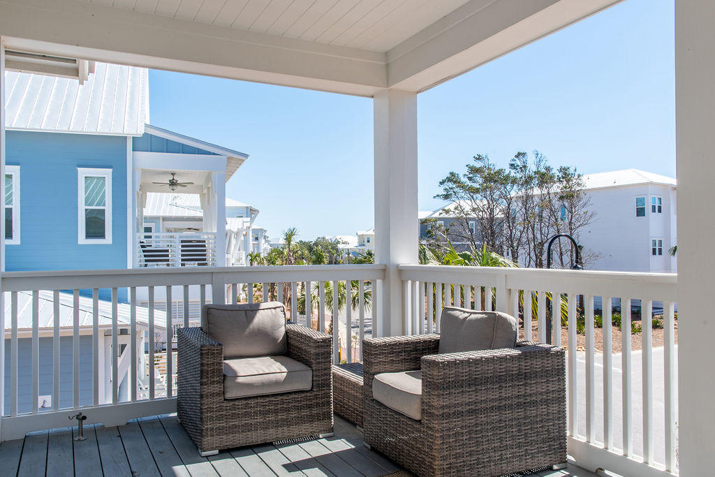 76 West Crabbing Hole Ln Inlet Beach Inlet Beach, FL 32461 - Photo 45 of 86 a bedroom with furniture and a large window