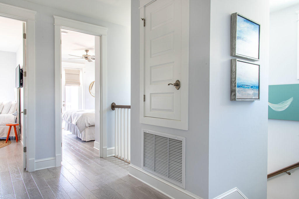76 West Crabbing Hole Ln Inlet Beach Inlet Beach, FL 32461 - Photo 49 of 86 a view of a hallway with wooden floor and a livingroom