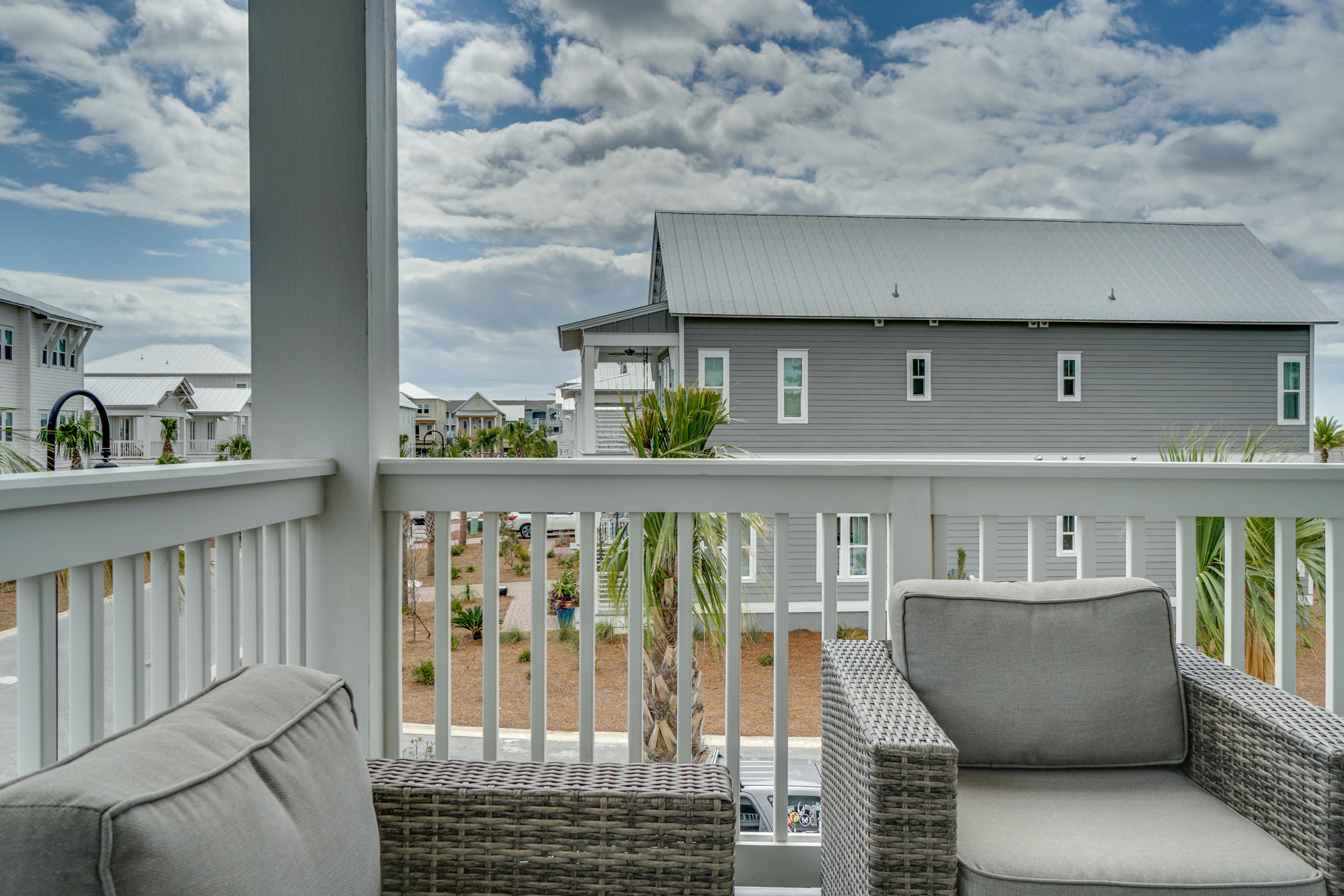 76 West Crabbing Hole Ln Inlet Beach Inlet Beach, FL 32461 - Photo 58 of 86 a view of roof deck with chair and wooden floor