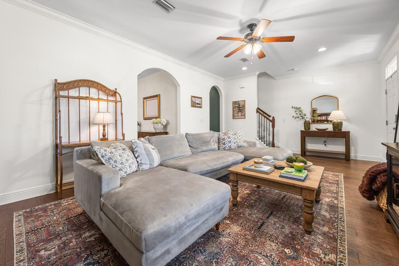 120 Mosaic Oaks Circle Santa Rosa Beach, FL 32459 - Photo 14 of 47 a living room with furniture and a chandelier