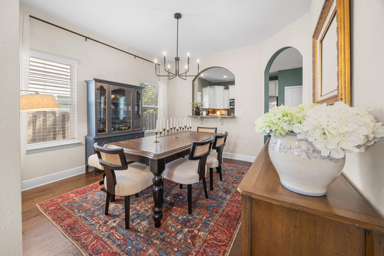 120 Mosaic Oaks Circle Santa Rosa Beach, FL 32459 - Photo 16 of 47 a dining room with furniture a window and a chandelier