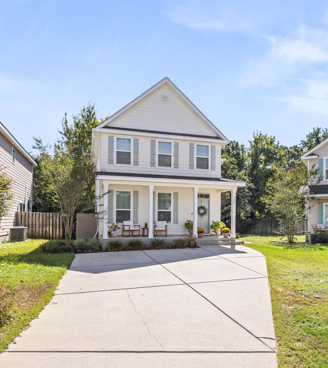 120 Mosaic Oaks Circle Santa Rosa Beach, FL 32459 - Photo 2 of 47 a front view of a house with garden