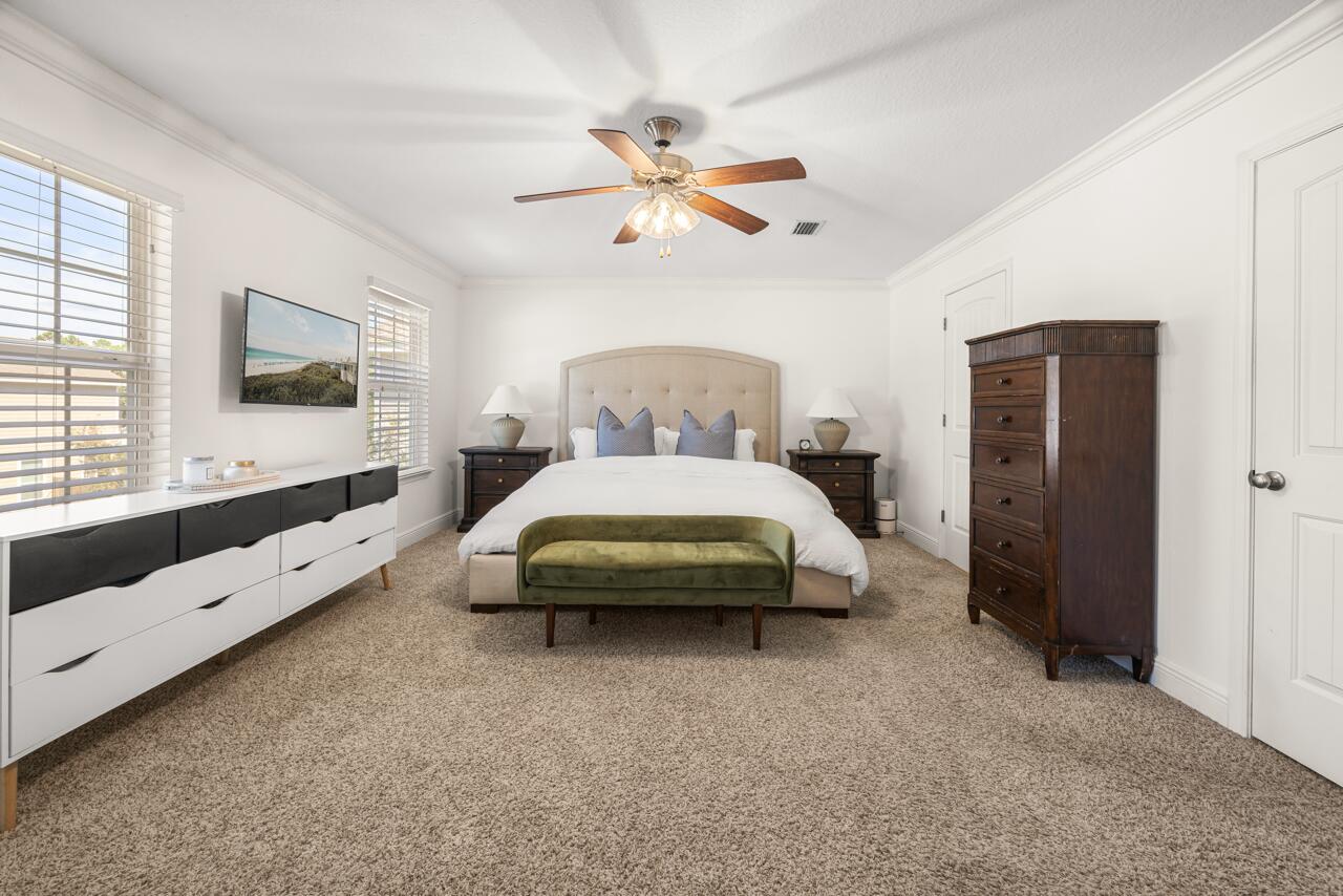 120 Mosaic Oaks Circle Santa Rosa Beach, FL 32459 - Photo 28 of 47 a spacious bedroom with a bed and a large window