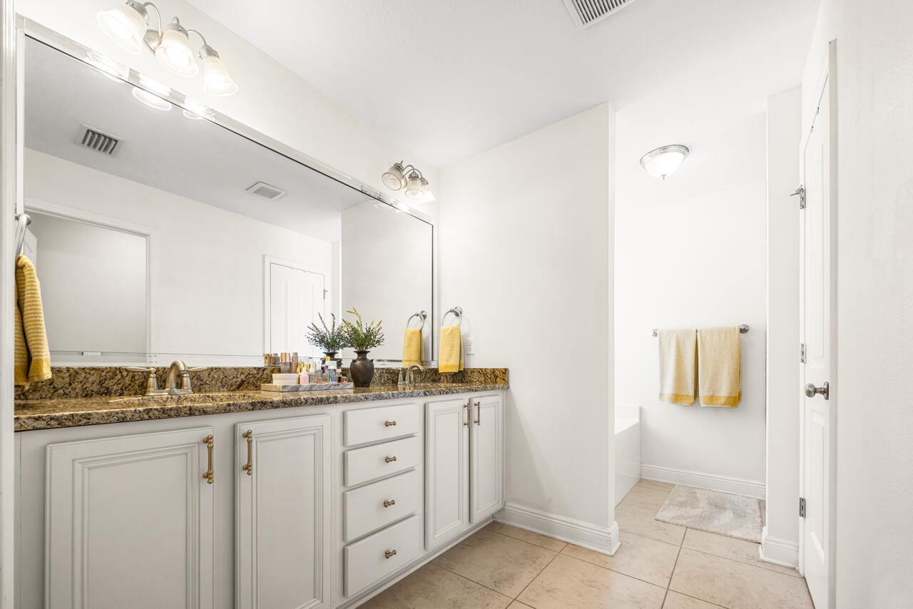 120 Mosaic Oaks Circle Santa Rosa Beach, FL 32459 - Photo 32 of 47 a bathroom with a sink and a mirror