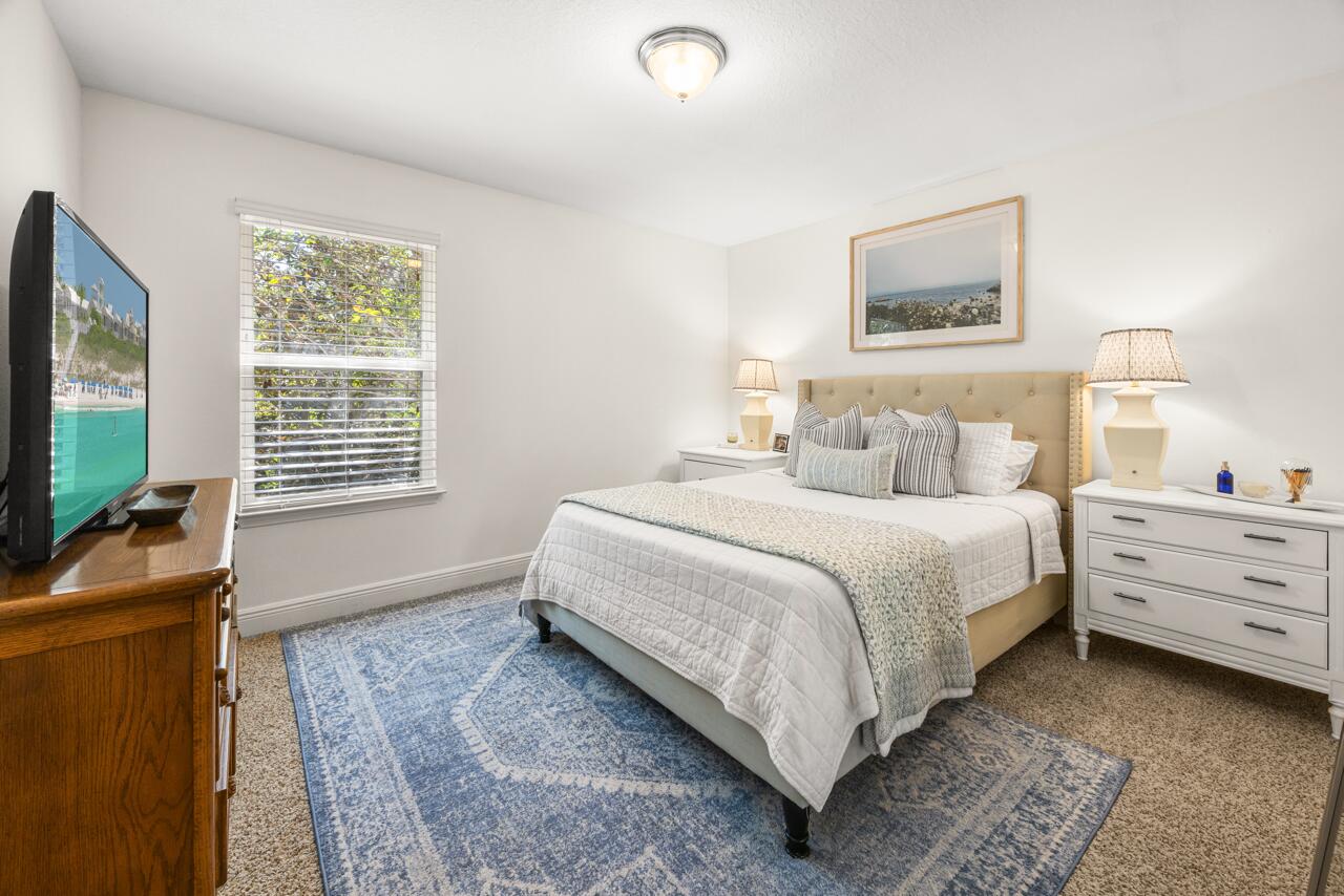 120 Mosaic Oaks Circle Santa Rosa Beach, FL 32459 - Photo 36 of 47 a bedroom with a bed and a flat screen tv