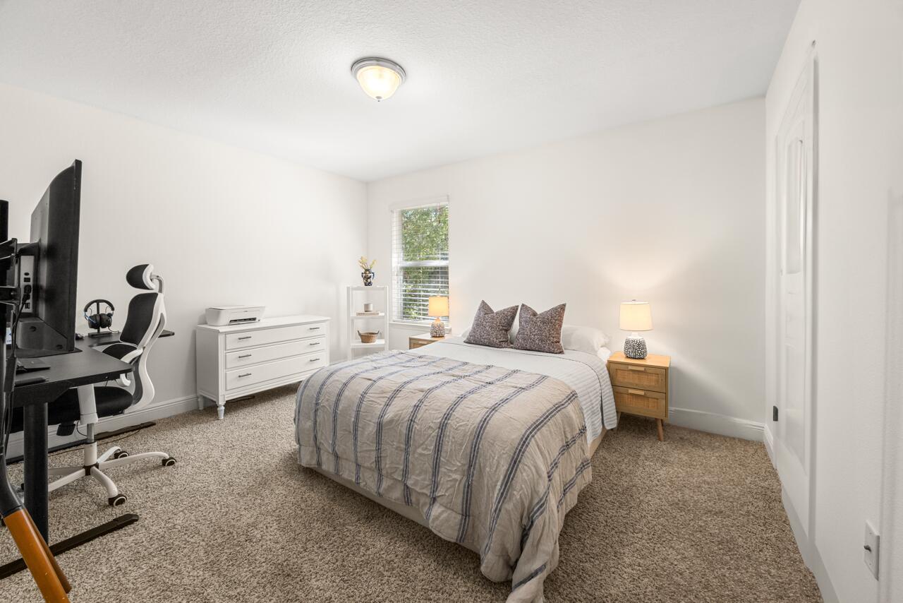 120 Mosaic Oaks Circle Santa Rosa Beach, FL 32459 - Photo 40 of 47 a bedroom with a bed and a desk