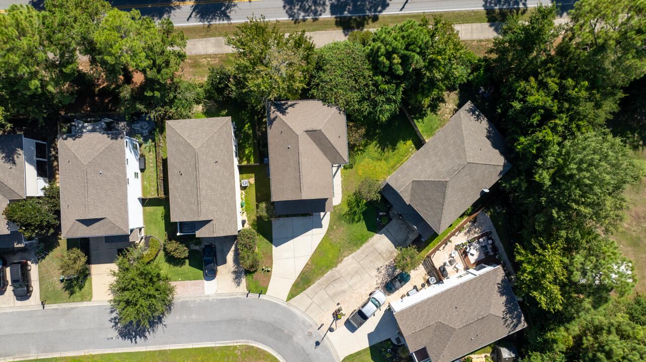 120 Mosaic Oaks Circle Santa Rosa Beach, FL 32459 - Photo 45 of 47 an aerial view of a house with outdoor space and a lake view