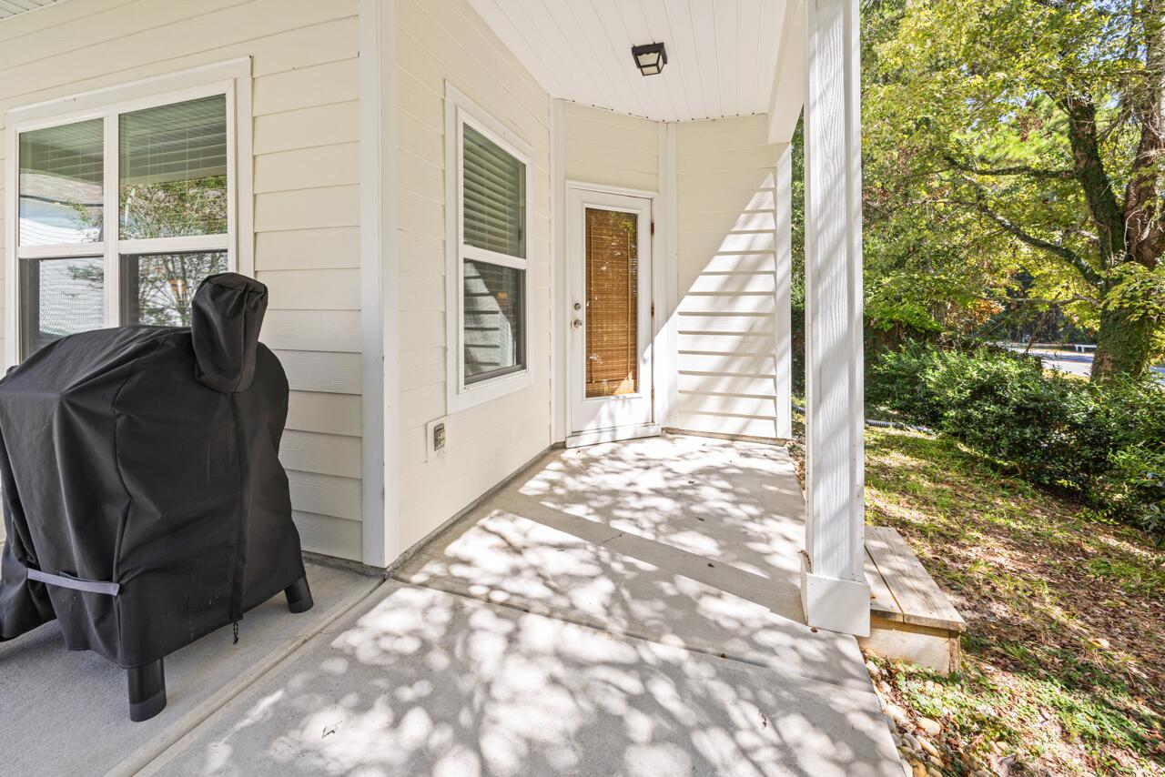 120 Mosaic Oaks Circle Santa Rosa Beach, FL 32459 - Photo 6 of 47 a view of a balcony with chair and front door