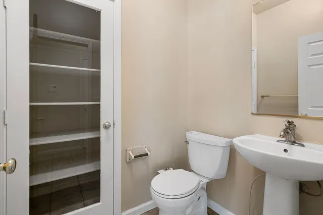 a bathroom with a double vanity sink and mirror