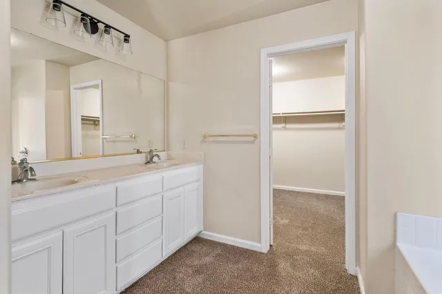 a backyard of a house with yard and outdoor seating