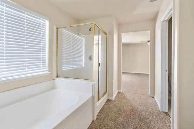 a kitchen with granite countertop a stove and a microwave