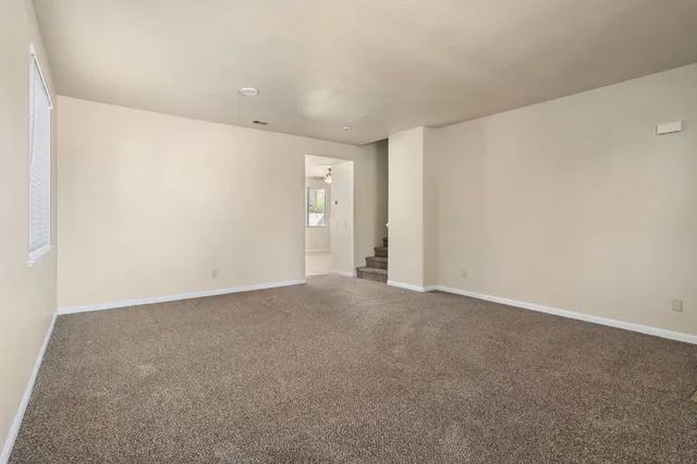 a kitchen with stainless steel appliances granite countertop white cabinets a stove top oven and dishwasher