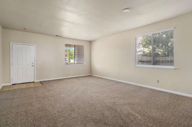 a view of an empty room with a fireplace