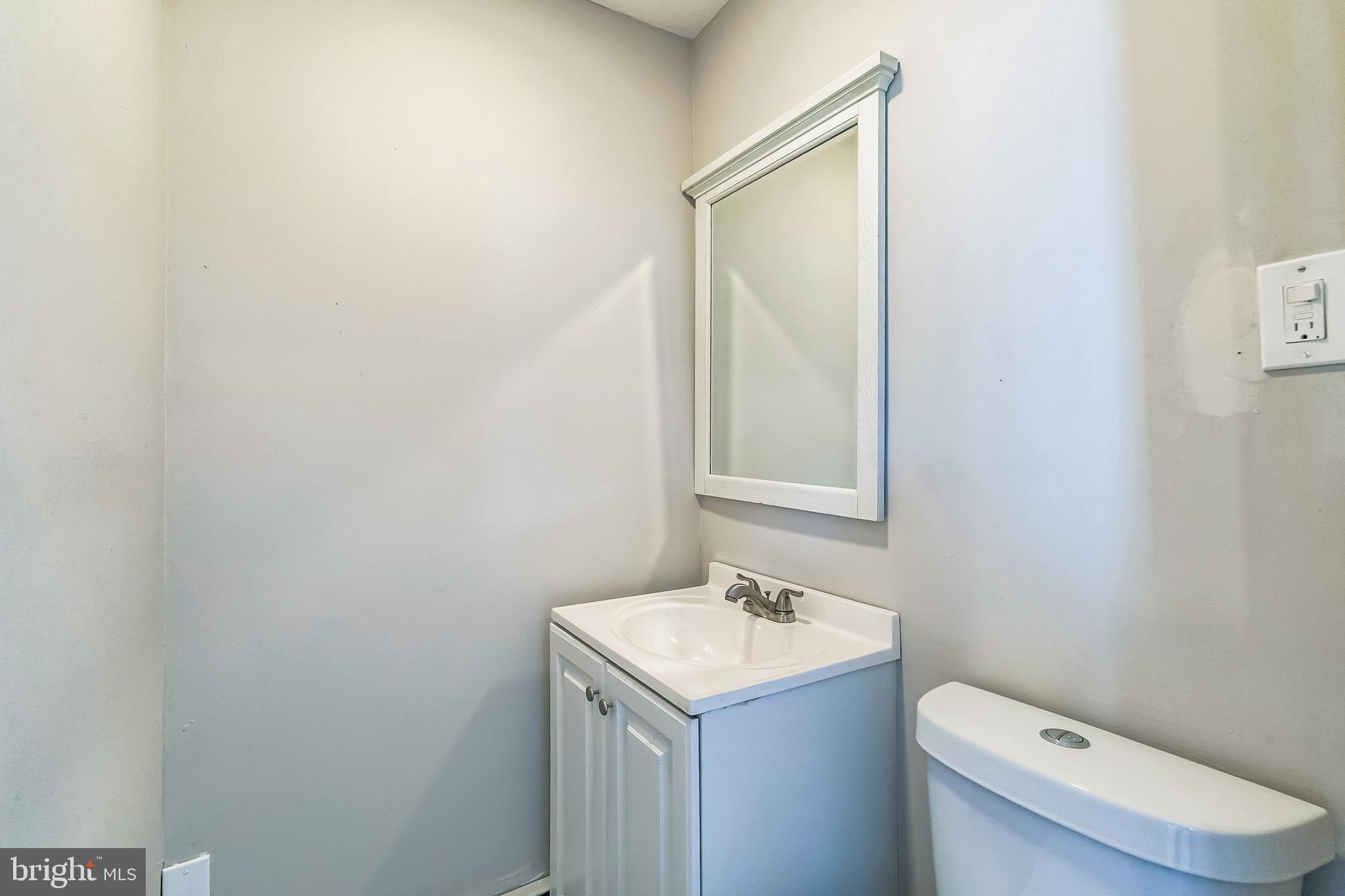 107 East Springfield Road Springfield, PA 19064 - Photo 17 of 40 a bathroom with a sink toilet and mirror