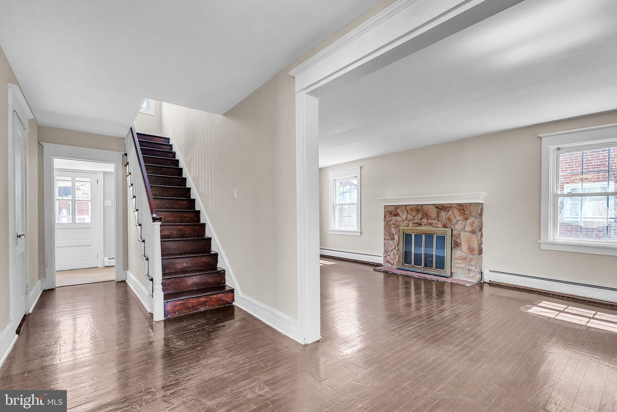 107 East Springfield Road Springfield, PA 19064 - Photo 19 of 40 a view of a livingroom with wooden floor and stairs