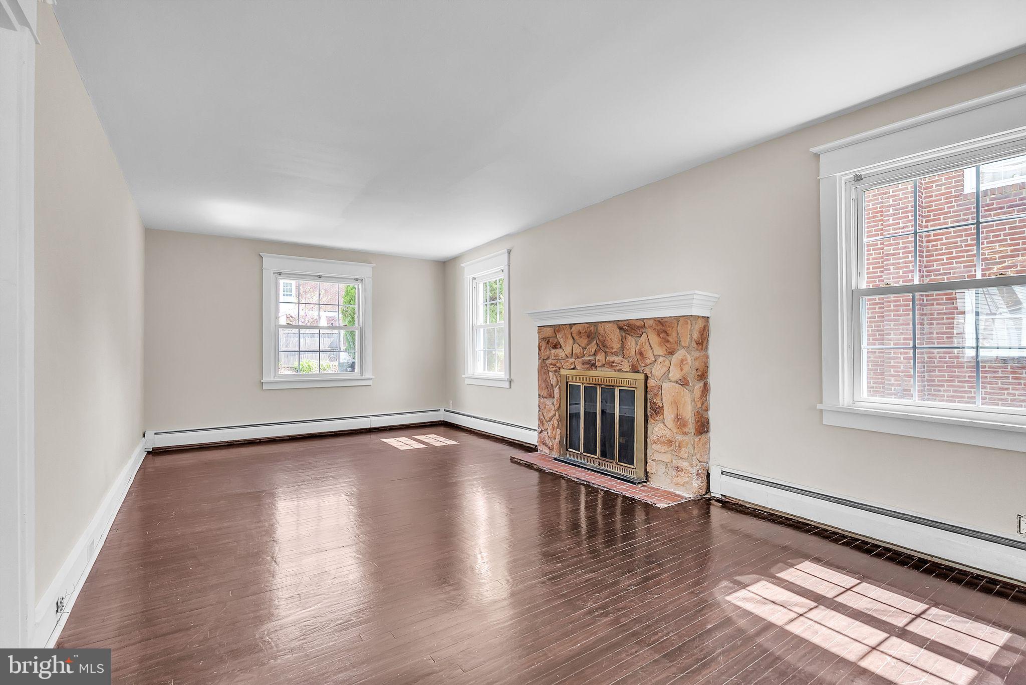 107 East Springfield Road Springfield, PA 19064 - Photo 20 of 40 wooden floor in an empty room with a window