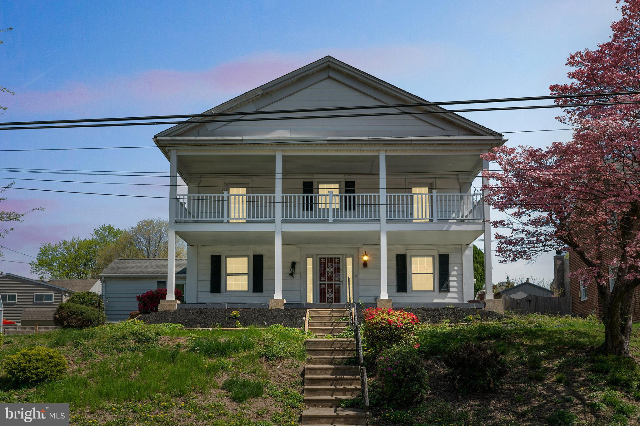107 East Springfield Road Springfield, PA 19064 - Photo 2 of 40 front view of a house with a yard