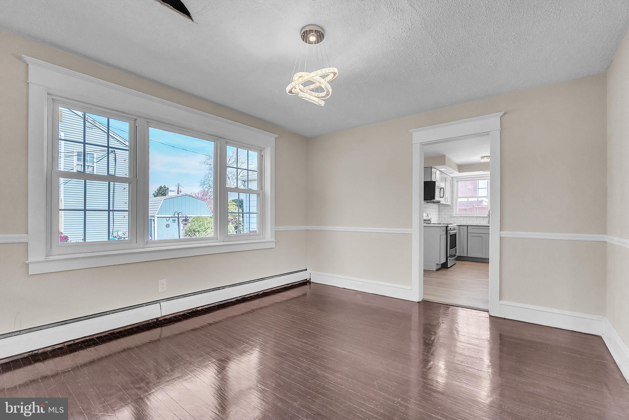 107 East Springfield Road Springfield, PA 19064 - Photo 22 of 40 wooden floor in an empty room with a window