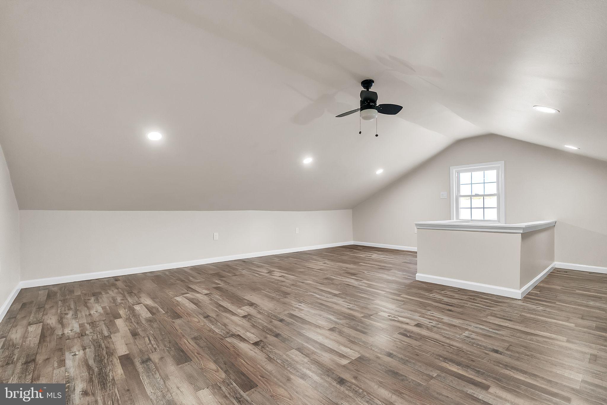 107 East Springfield Road Springfield, PA 19064 - Photo 31 of 40 an empty room with wooden floor and windows