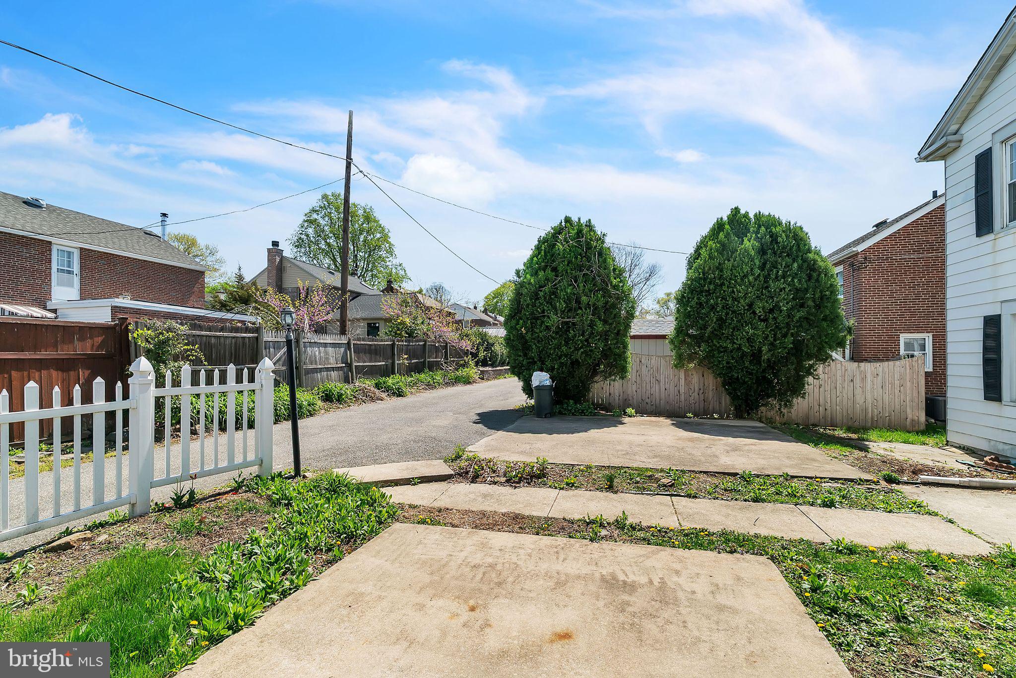 107 East Springfield Road Springfield, PA 19064 - Photo 10 of 40 a street view with a garden