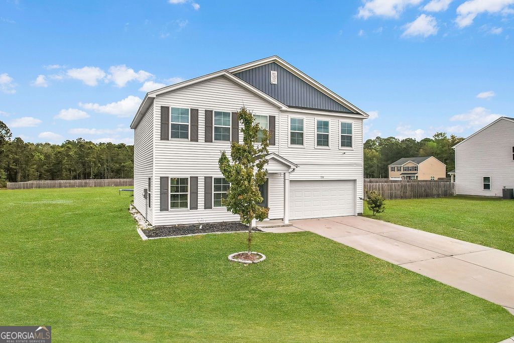 a front view of a house with a yard