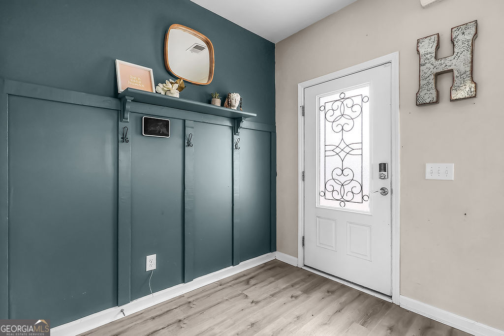 231 Caroline Way Guyton, GA 31312 - Photo 3 of 47 a view of a hallway to rooms