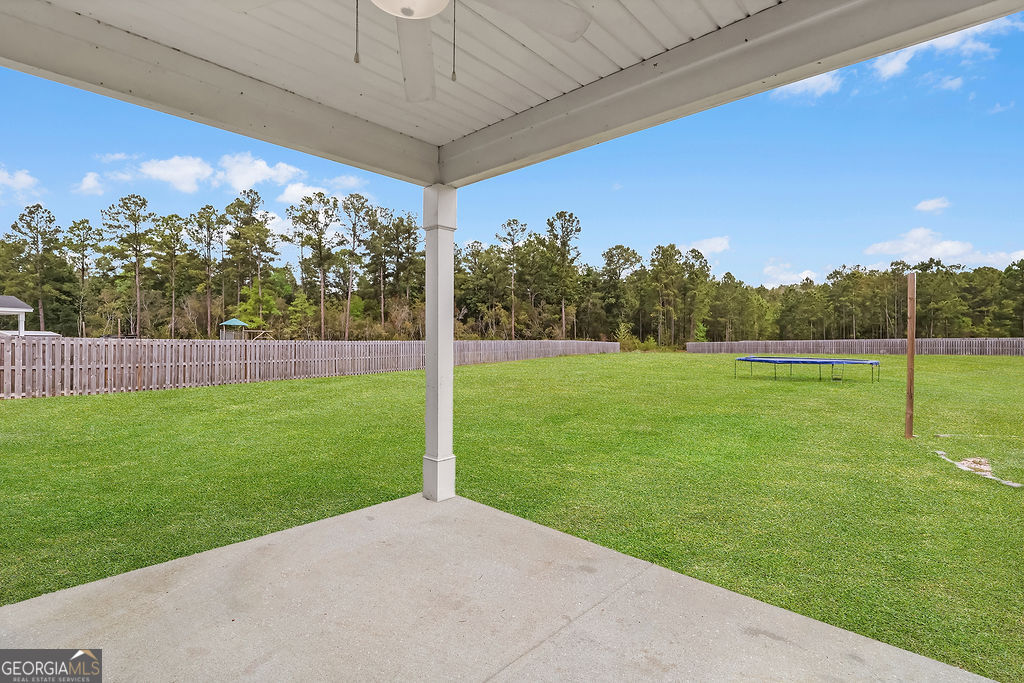 231 Caroline Way Guyton, GA 31312 - Photo 41 of 47 a view of a yard with a big yard