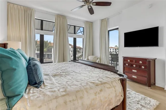 a bedroom with a bed and a television