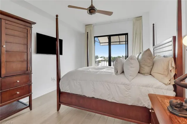 a bedroom with a bed window and dresser