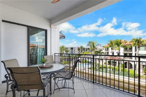 a view of a balcony with furniture
