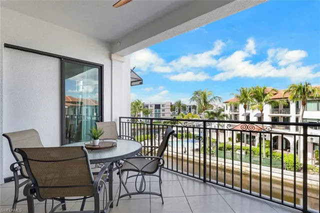 a view of a balcony with furniture