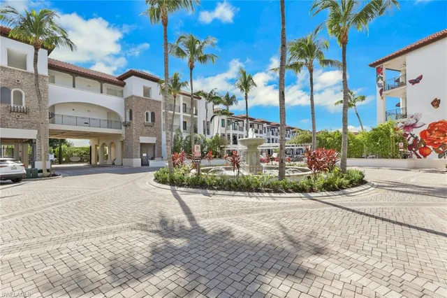 a bedroom with a bed and a flat tv screen