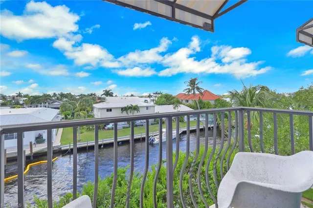 a view of a swimming pool with seating area