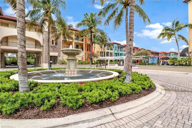 a view of multiple houses with a swimming pool