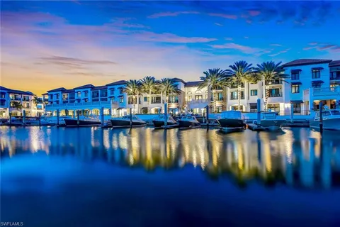 a view of a lake with a car parked in front of it