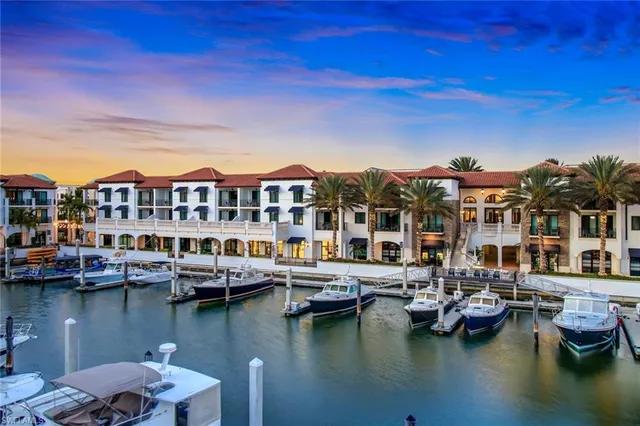 a living room with hard wood floor furniture and floor to ceiling window