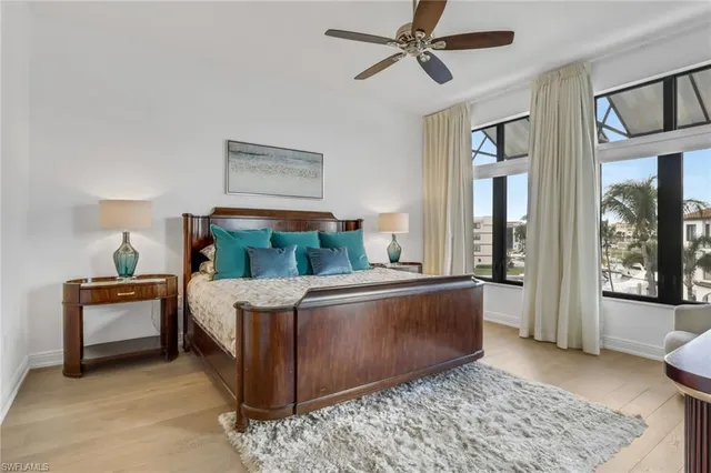 a living room with furniture and windows