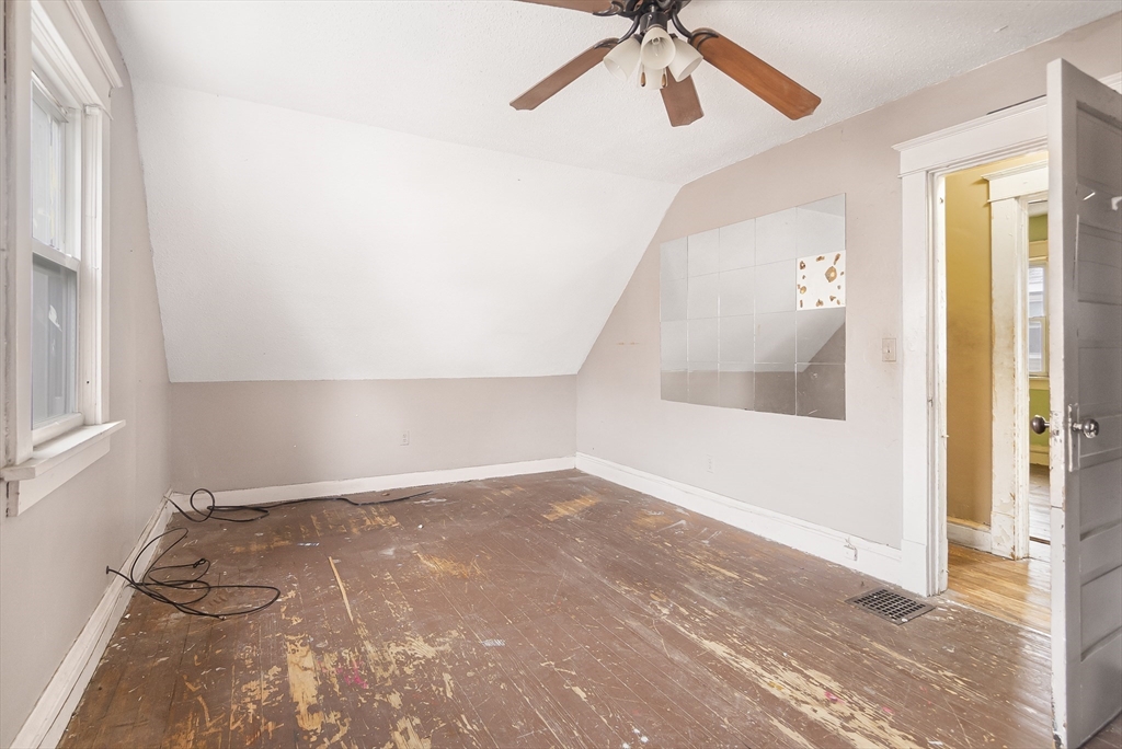 62 Kenyon Street Springfield, MA 01109 - Photo 12 of 19 a view of an empty room with a window
