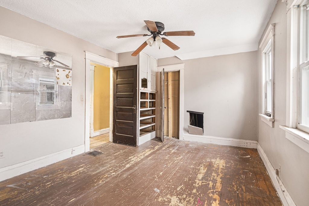 62 Kenyon Street Springfield, MA 01109 - Photo 13 of 19 a view of empty room with a ceiling fan and window