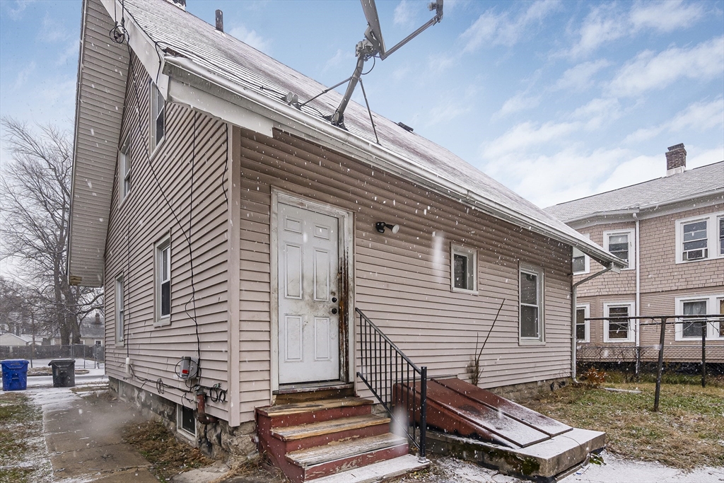 62 Kenyon Street Springfield, MA 01109 - Photo 18 of 19 a view of a patio with a table and chairs