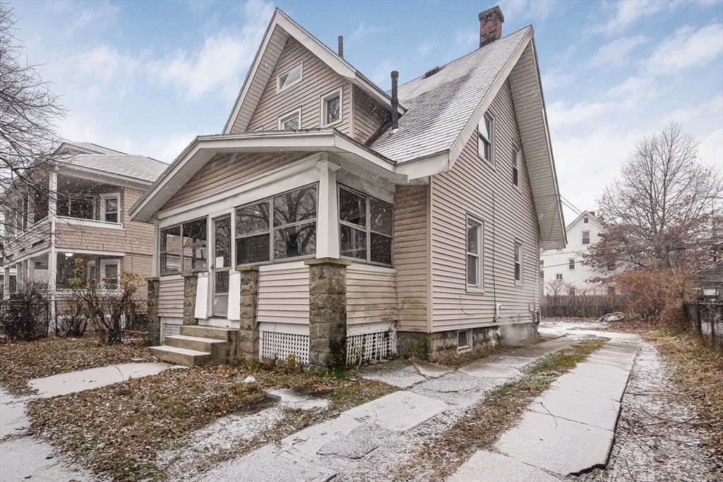 62 Kenyon Street Springfield, MA 01109 - Photo 2 of 19 a view of a white house with a large windows