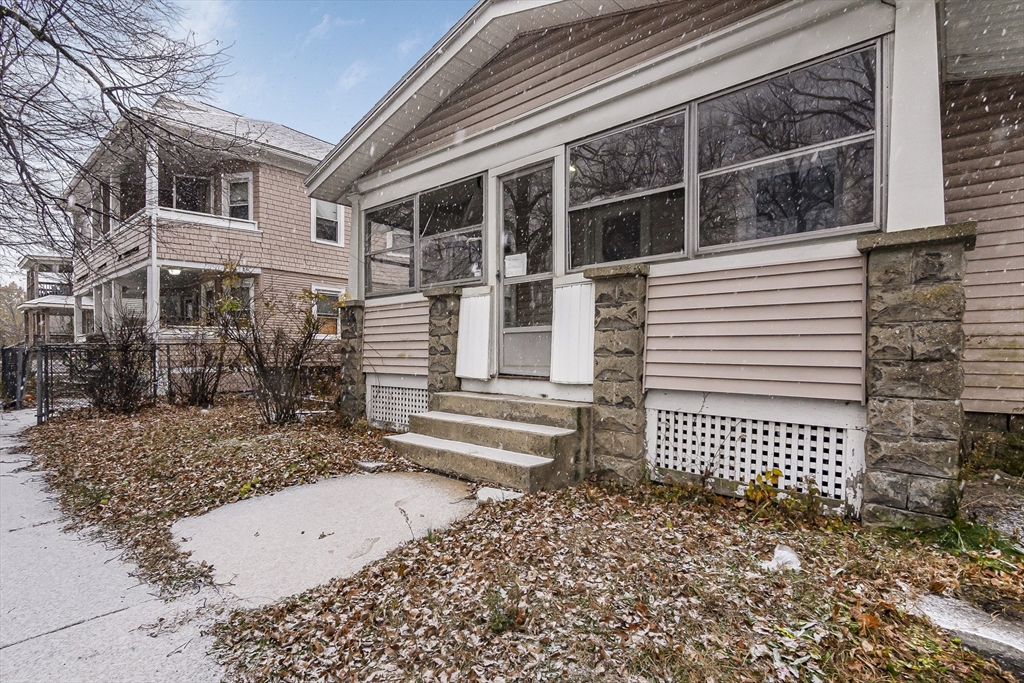 62 Kenyon Street Springfield, MA 01109 - Photo 3 of 19 a view of a house with a window and wooden fence