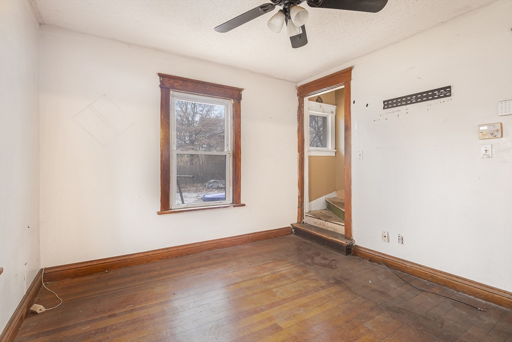 62 Kenyon Street Springfield, MA 01109 - Photo 6 of 19 a view of an empty room with a window