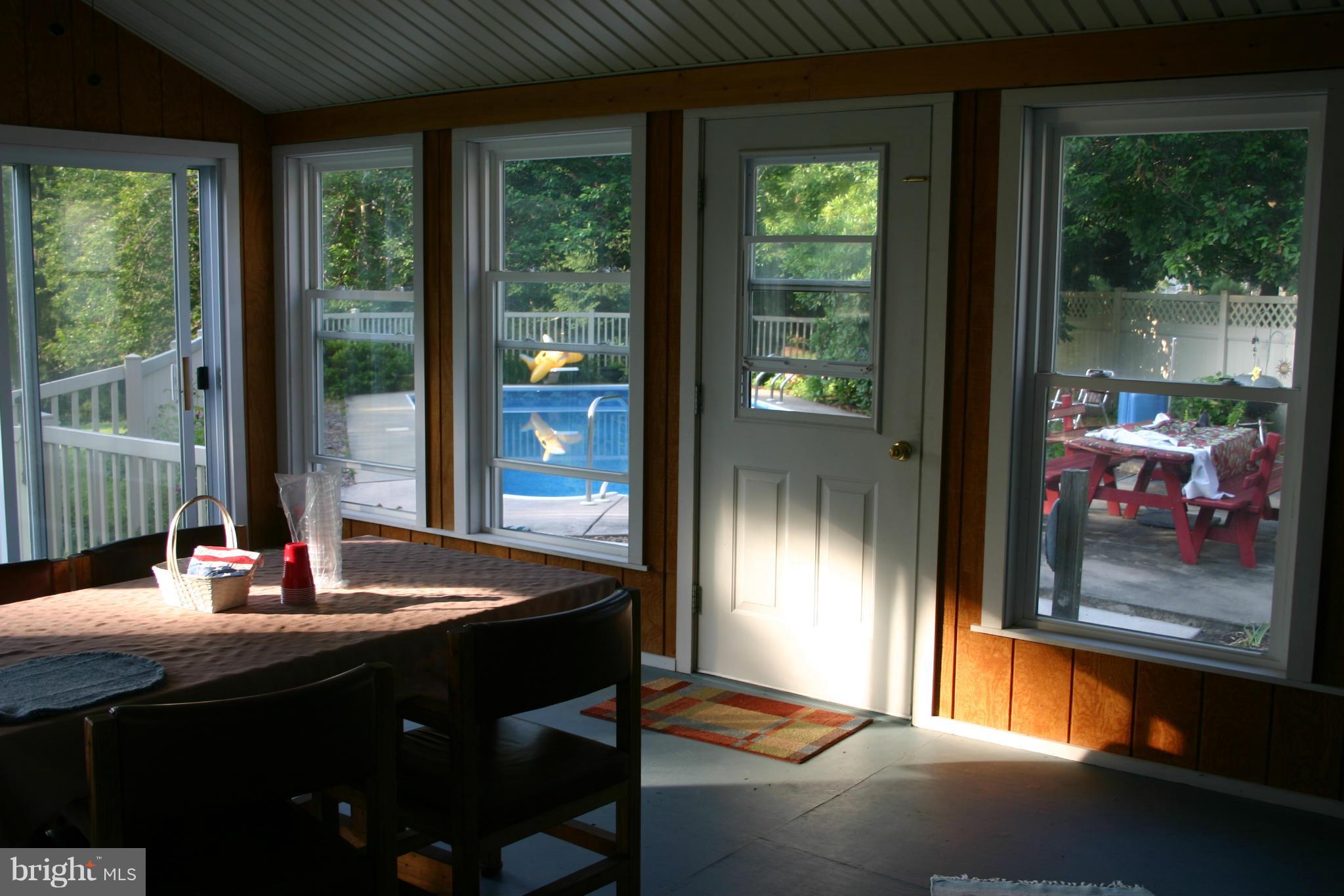 14003 Glen High Road Baldwin, MD 21013 - Photo 17 of 26 a dining room with a table and chairs