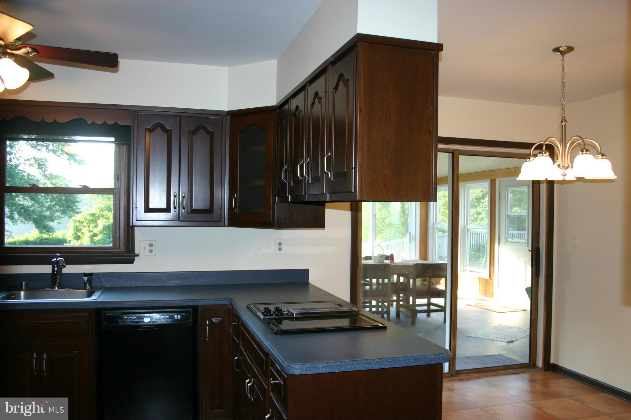 14003 Glen High Road Baldwin, MD 21013 - Photo 6 of 26 a kitchen with a sink a window and cabinets