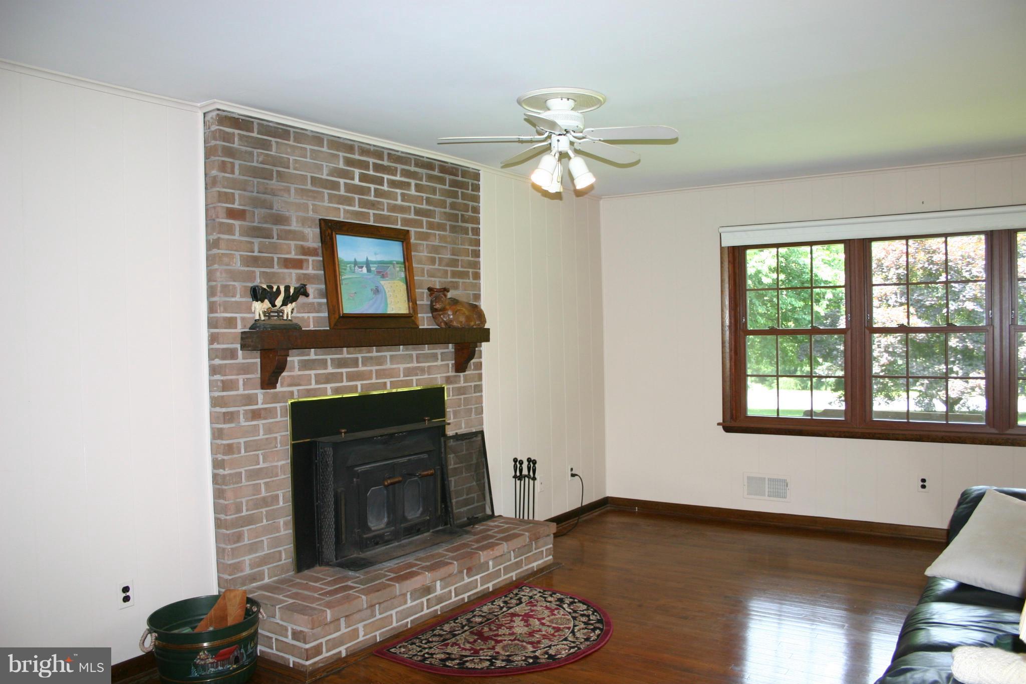 14003 Glen High Road Baldwin, MD 21013 - Photo 8 of 26 a living room with furniture and a fireplace