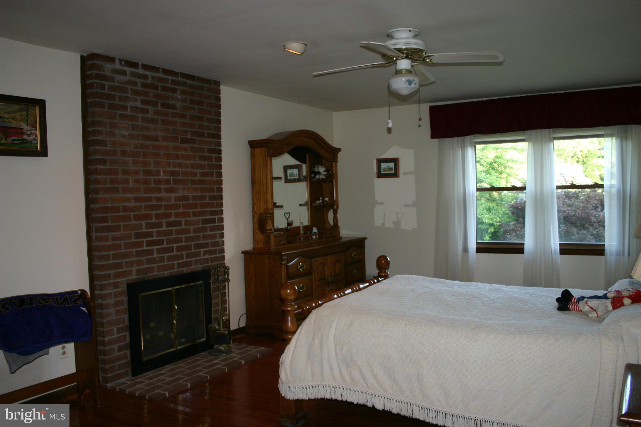 14003 Glen High Road Baldwin, MD 21013 - Photo 9 of 26 a bedroom with a bed and a chandelier